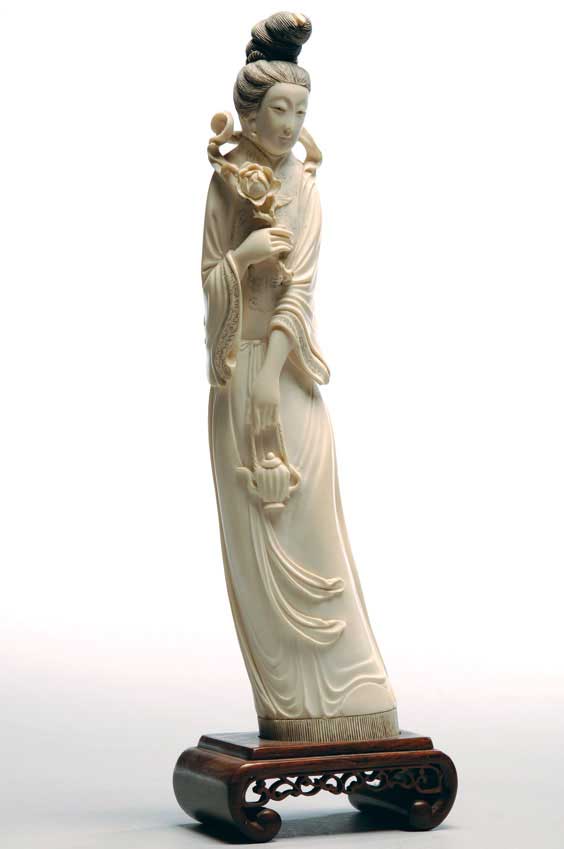 Appraisal: CHINESE CARVED IVORY GUANYIN Chinese carved ivory figure of Guanyin