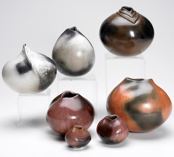 Appraisal: EFFIE Seven assorted ceramic vessels each with pinched rim one