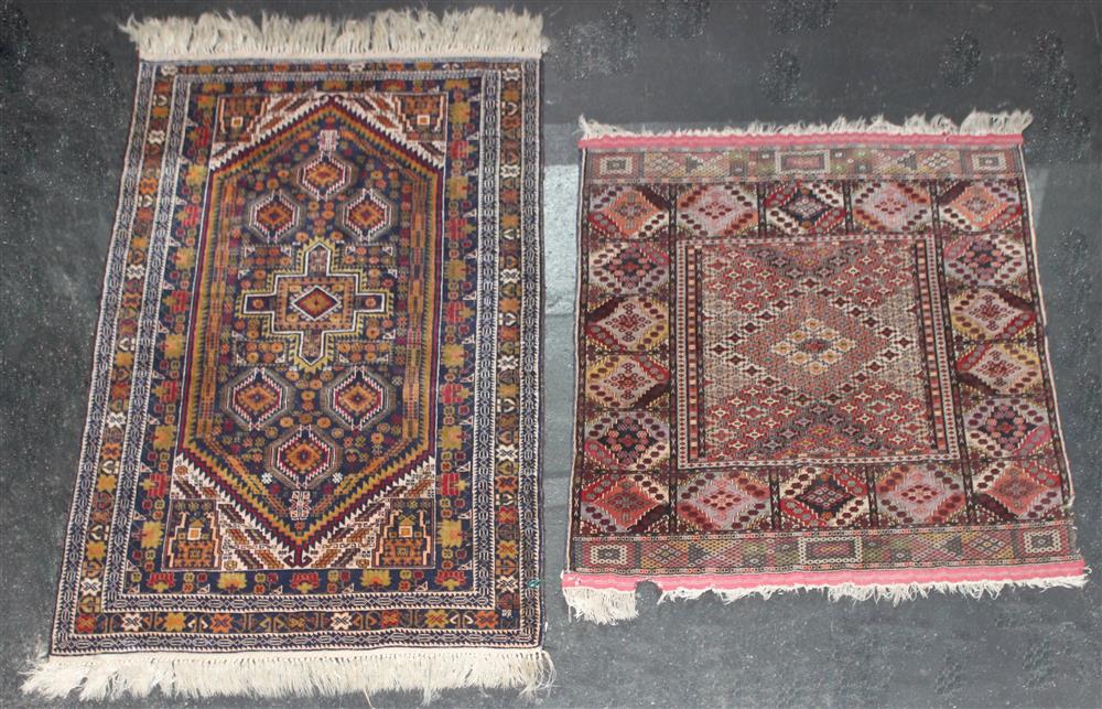 Appraisal: TWO CAUCASIAN WOOL RUGS the first with geometric design in