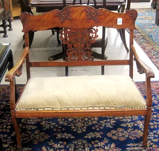 Appraisal: LATE VICTORIAN SETTEE American c having a carved back cherry