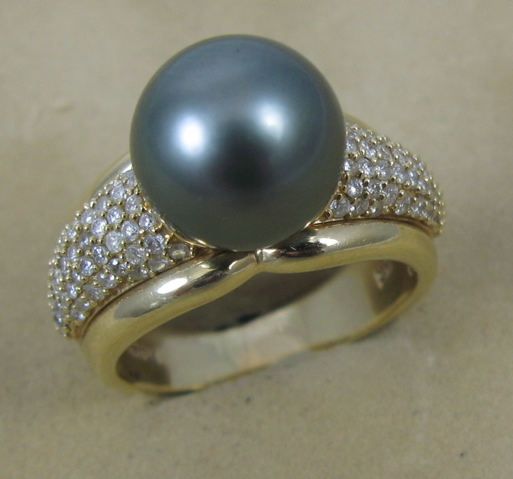 Appraisal: BLACK PEARL AND FOURTEEN KARAT GOLD RING centering a large