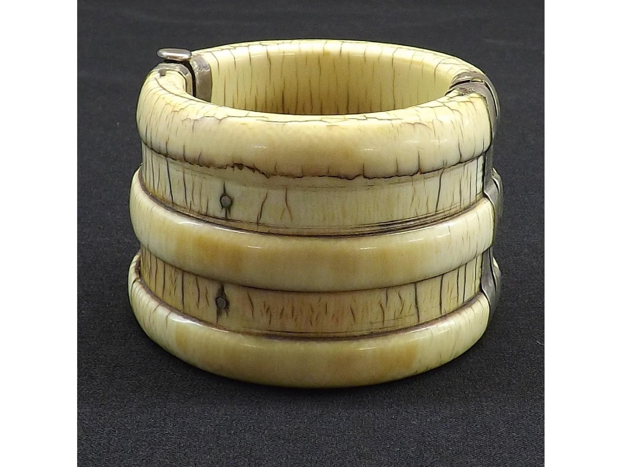 Appraisal: Antique Oriental ribbed ivory bangle with white metal clasps diameter