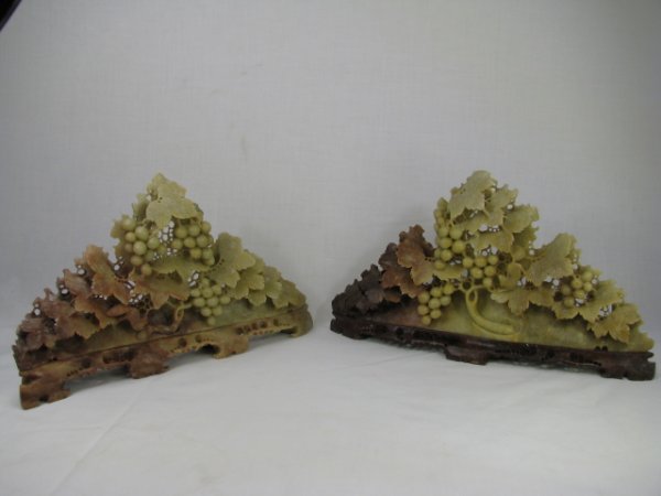 Appraisal: Pair th century hand carved Chinese soapstone bookends with grapes