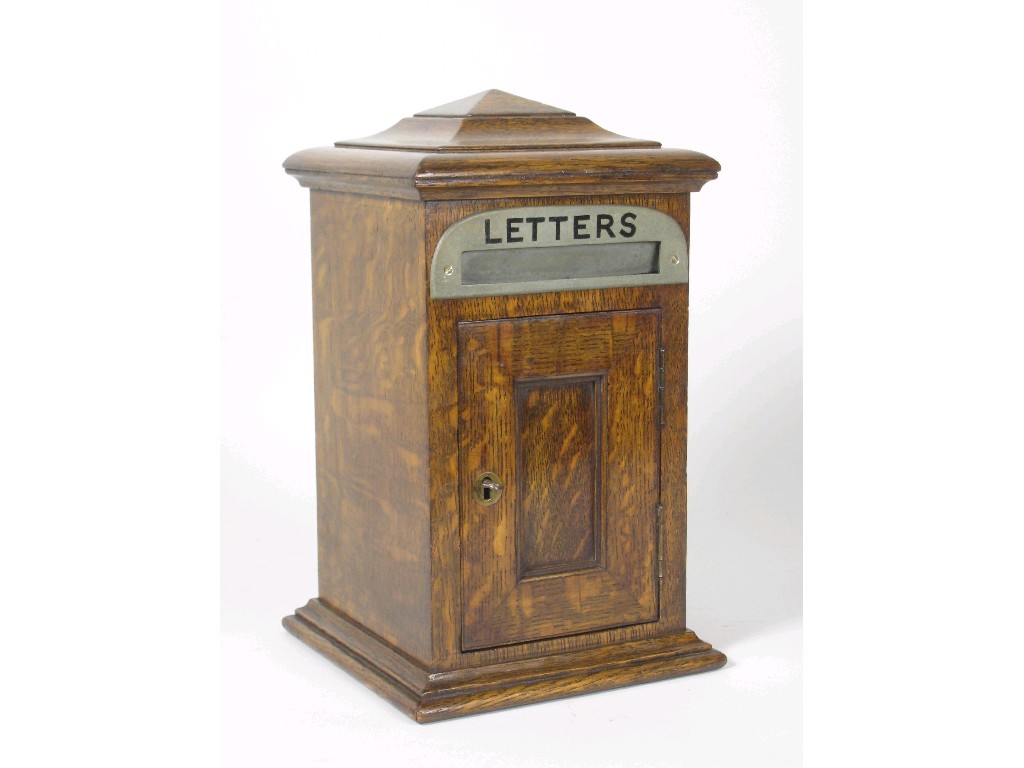 Appraisal: An oak country house Letter Box with moulded top above