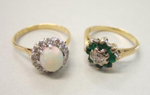 Appraisal: A gold and platinum opal and diamond set cluster ring