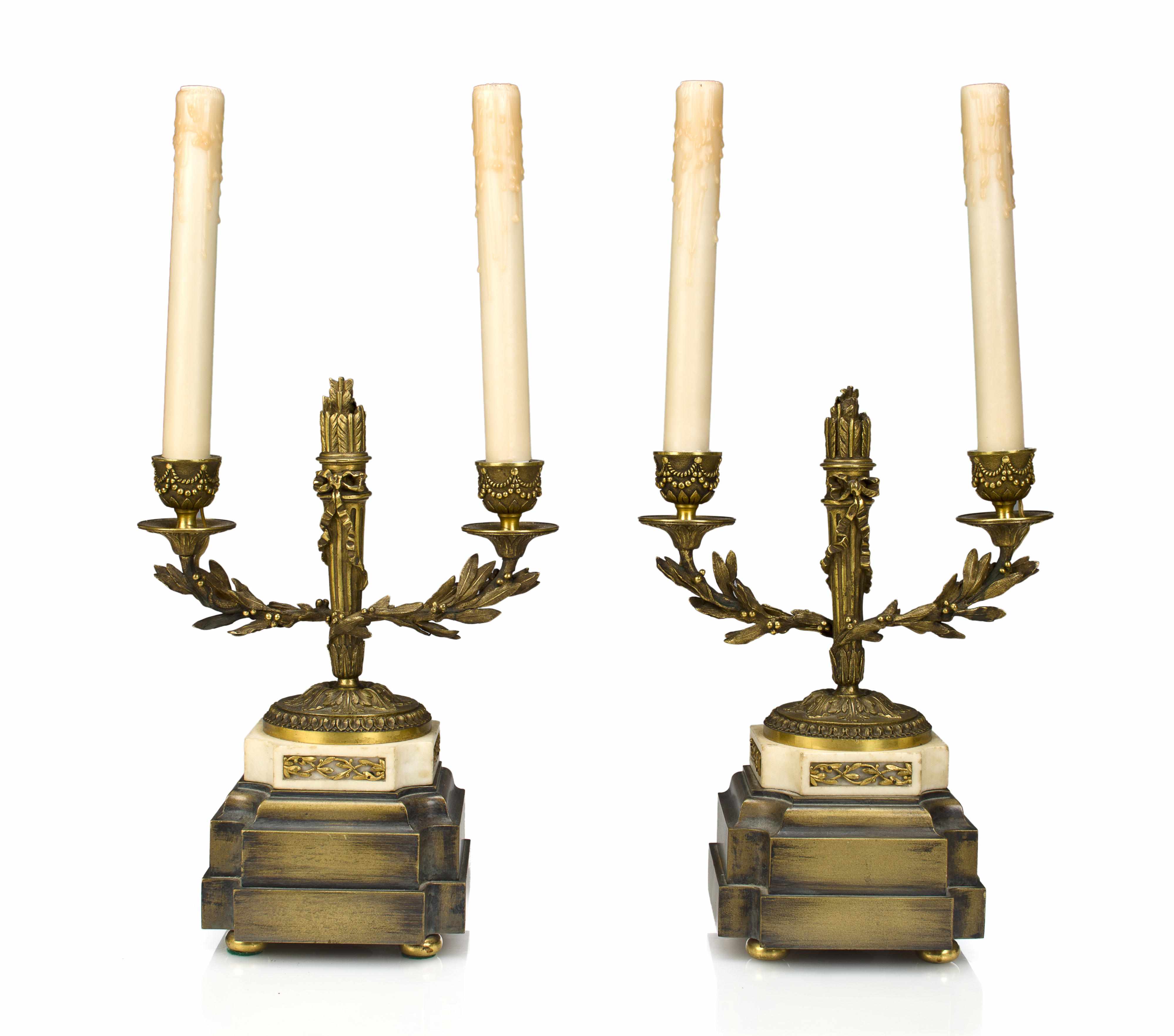 Appraisal: A pair of Neoclassical style bronze and white marble two