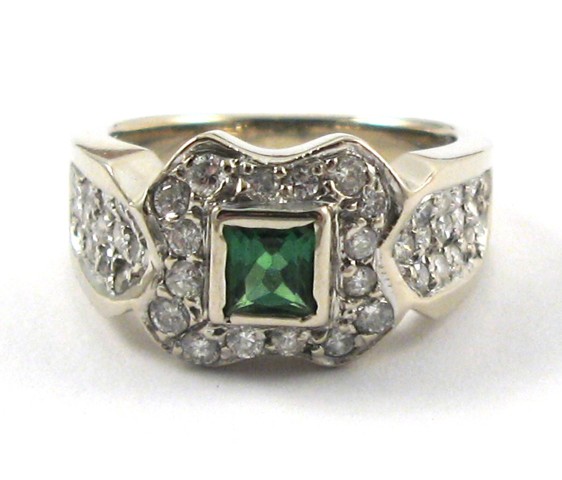 Appraisal: EMERALD DIAMOND AND WHITE GOLD RING The top half of