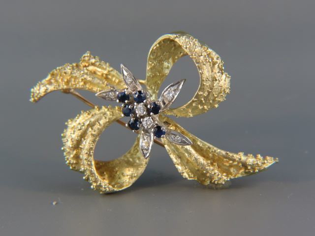 Appraisal: Diamond Sapphire Bow Brooch six deep blue sapphires and five