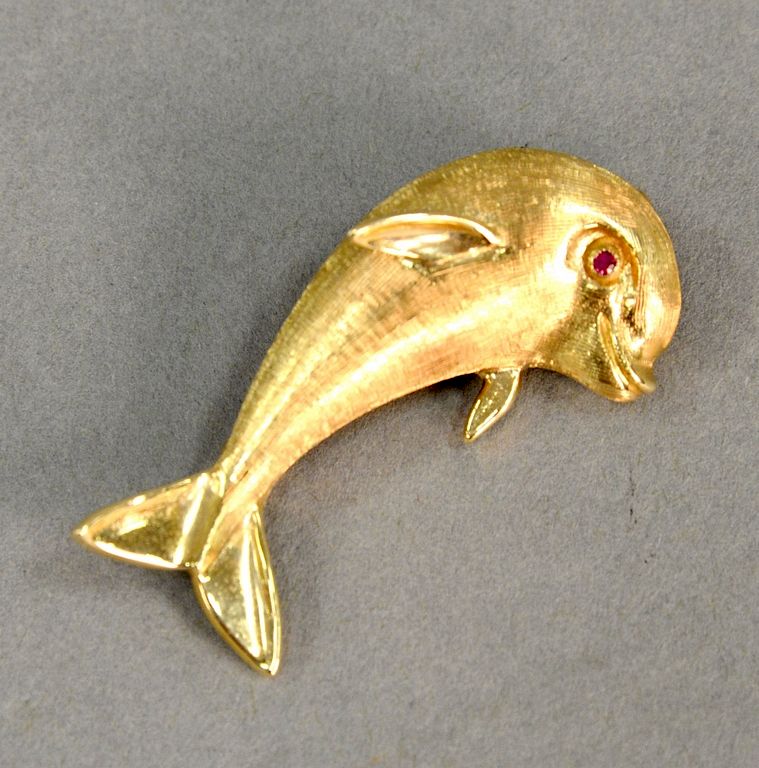 Appraisal: karat gold dolphin pin with red eye grams karat gold