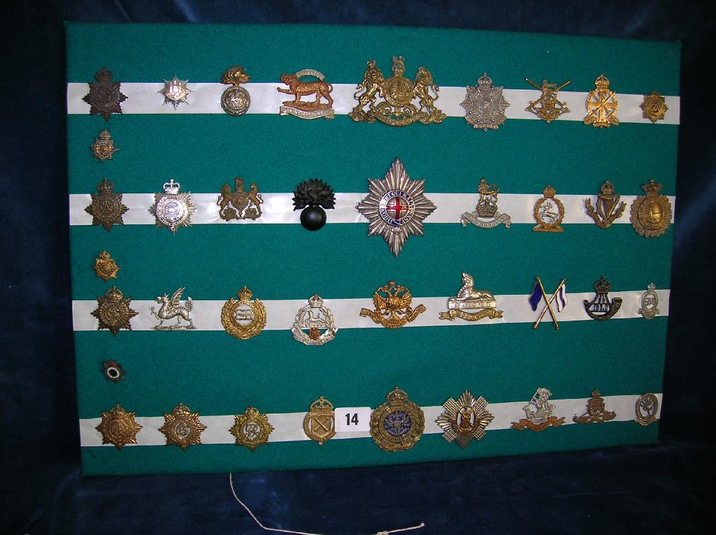 Appraisal: A collection of assorted British military cap badges on card