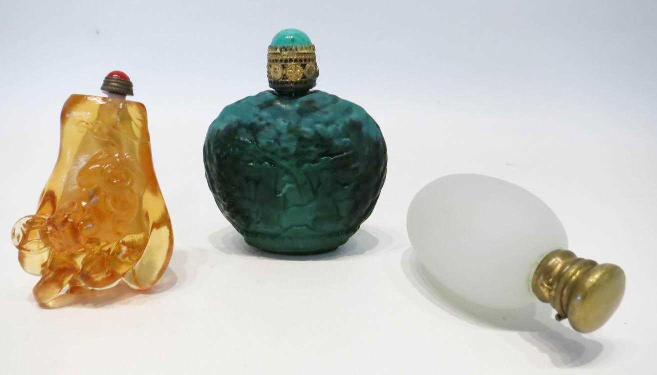 Appraisal: THREE GLASS SNUFF BOTTLES frosted white in egg form amber