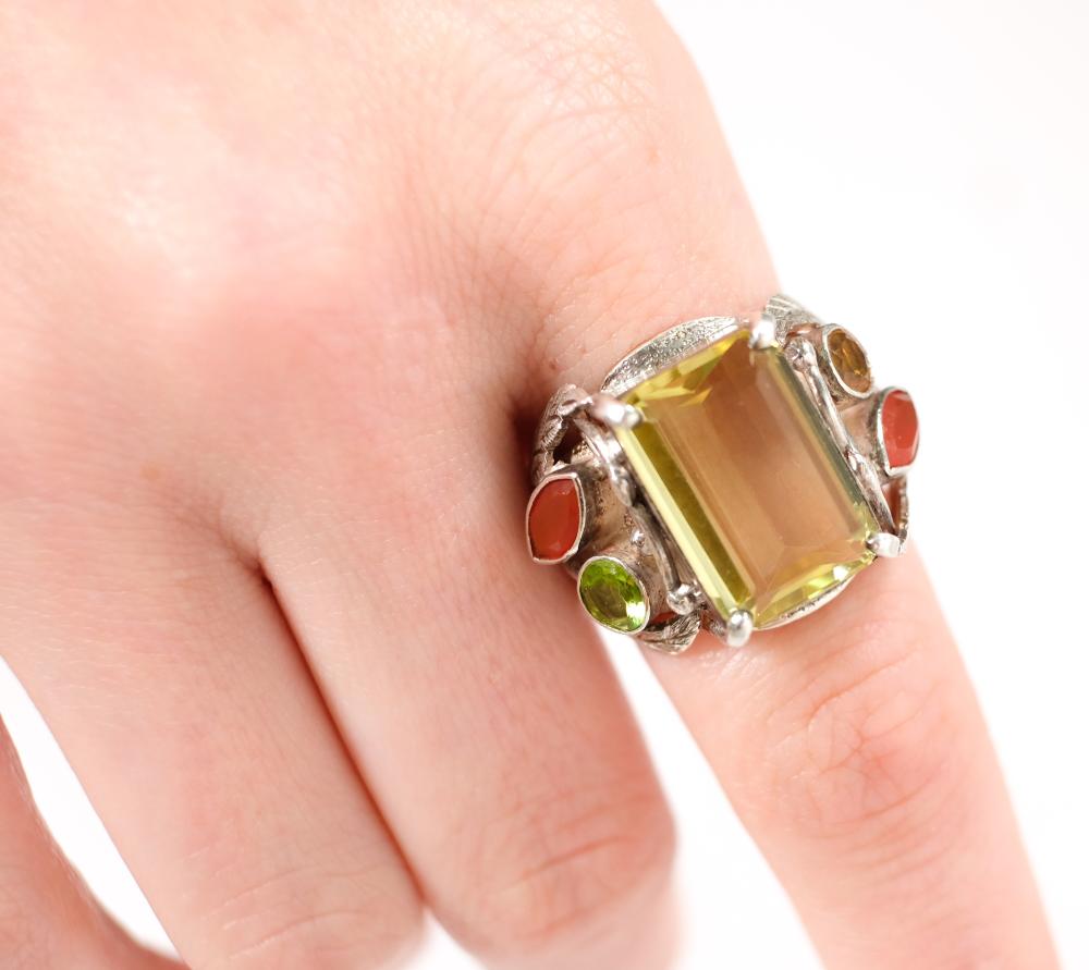 Appraisal: Sterling silver ring set with a rectangular x mm Lemon