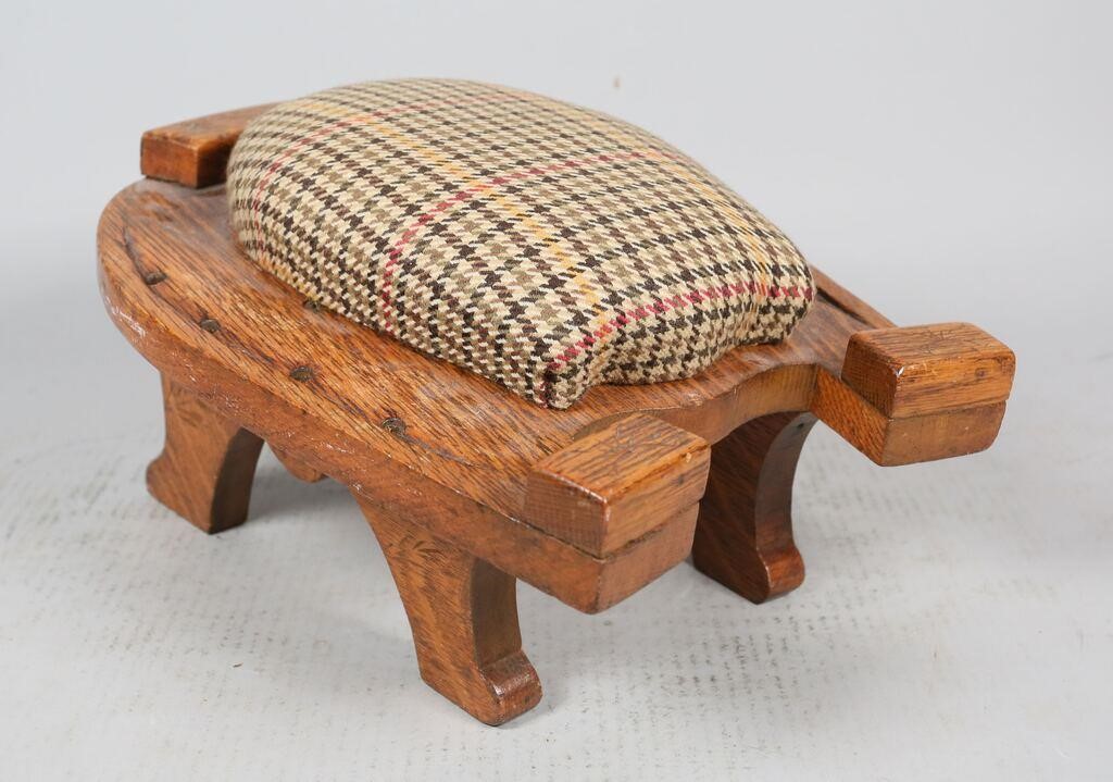 Appraisal: Upholstered foot stool in the shape of a horseshoe Chip