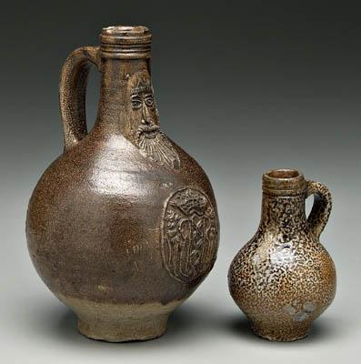 Appraisal: Two Bellarmine salt glazed jugs one bottle form with mask