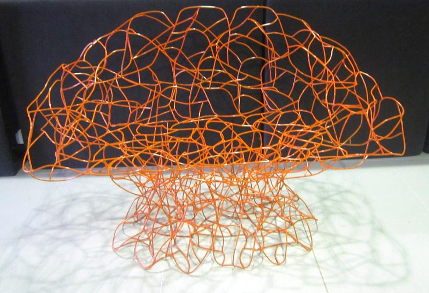 Appraisal: A CONTEMPORARY ORANGE WOVEN WIRE TWO SEATER CHAIR A CONTEMPORARY