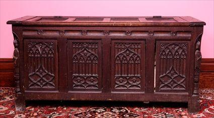 Appraisal: ENGLISH GOTHIC-STYLE CARVED OAK PANELED CHEST The rectangular paneled hinged