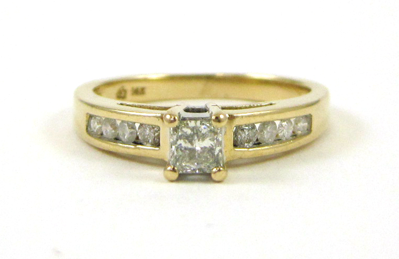 Appraisal: DIAMOND AND FOURTEEN KARAT GOLD RING with four round-cut diamonds