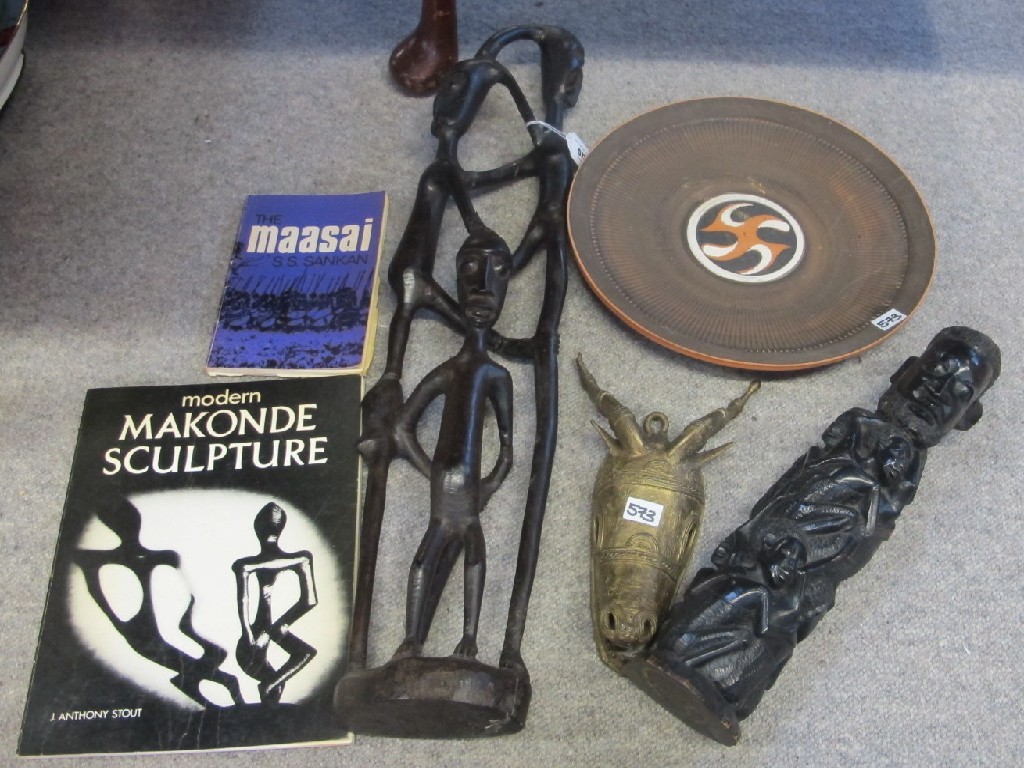 Appraisal: MacKonde sculpture with book by J Anthony Stout another carved