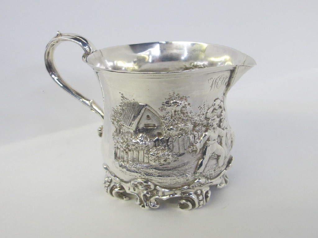 Appraisal: Silver cream jug embossed with a rural scene with figures