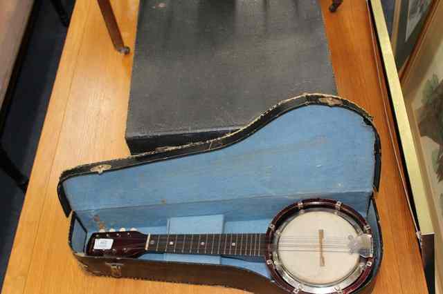 Appraisal: A BRITISH MADE BAJOLELE BANJO MANDOLIN together with a concertina