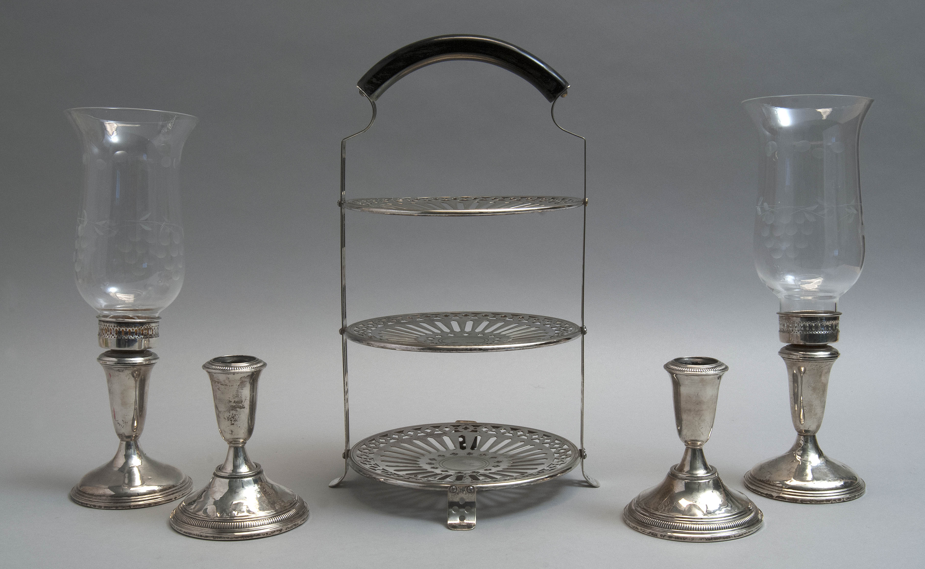 Appraisal: TWO PAIRS OF WEIGHTED STERLING SILVER CANDLESTICKS AND A SILVER