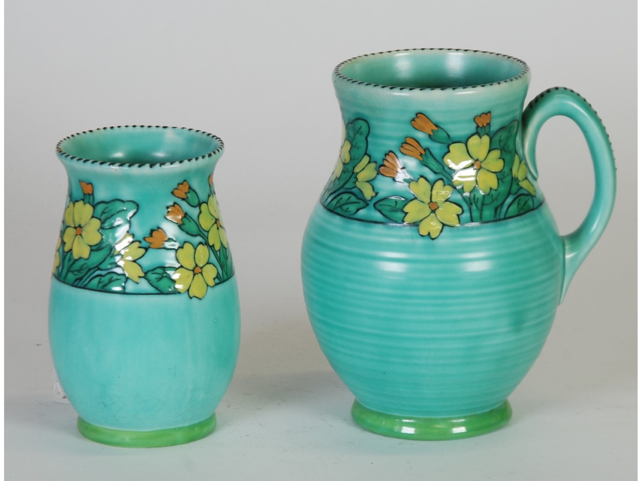 Appraisal: 's CROWN DUCAL CHARLOTTE RHEAD GREEN GLAZED JUG with tube