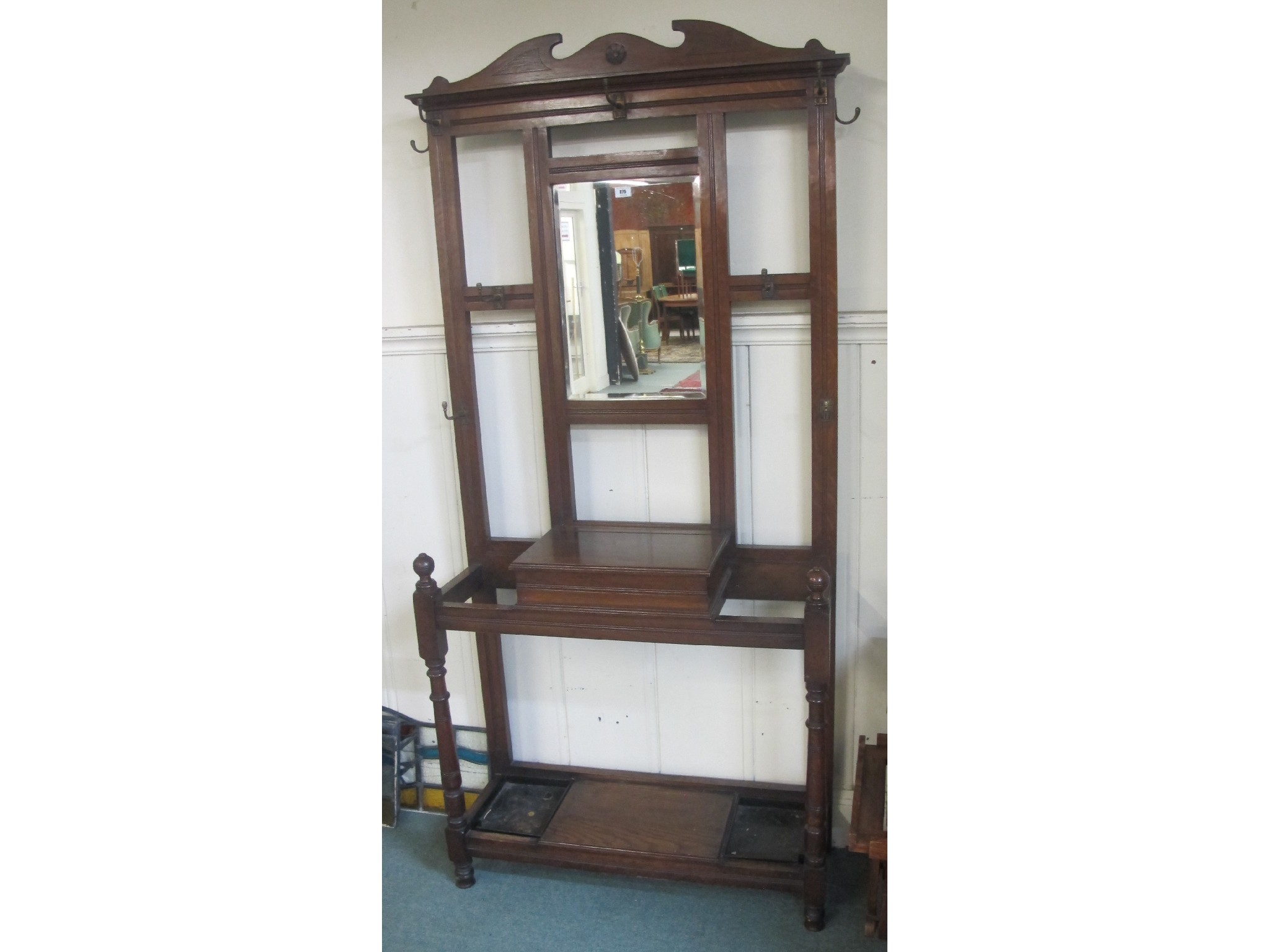 Appraisal: An Edwardian oak mirror back hall stand