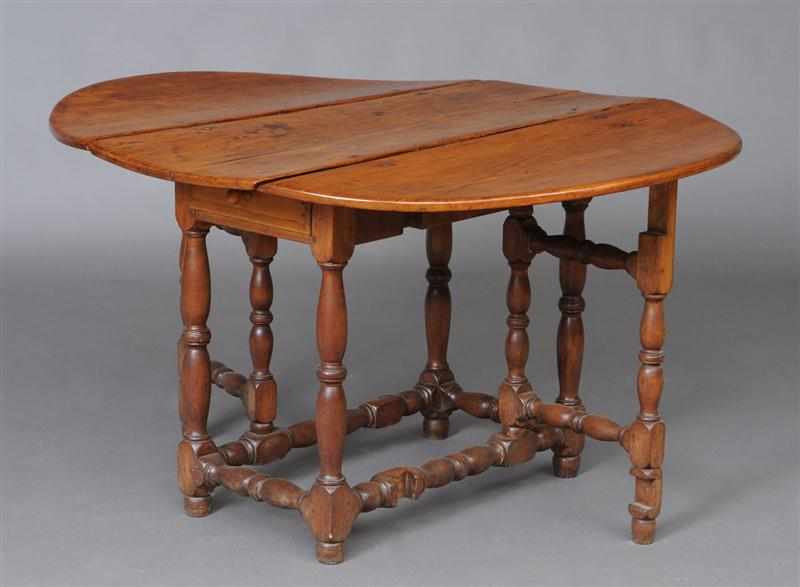 Appraisal: AMERICAN MAPLE GATE-LEG TABLE With slightly bowed ends and two