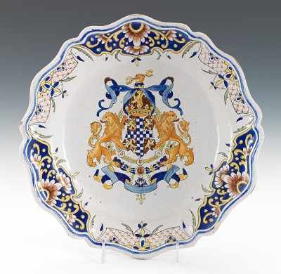 Appraisal: A Malicore Faience Armorial Charger Shaped rim deep charger hand