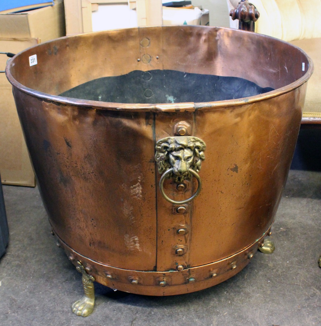 Appraisal: A large copper cistern for logs with studded bands brass