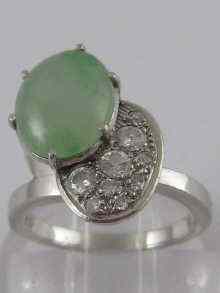 Appraisal: A white metal tests platinum jade and diamond ring of