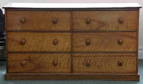 Appraisal: A Victorian satinwood chest fitted two banks of three drawers