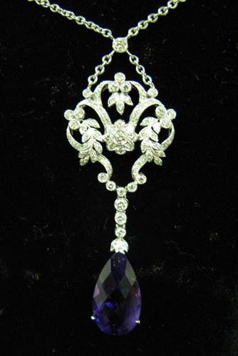 Appraisal: AN EDWARDIAN STYLE DIAMOND AMETHYST AND EIGHTEEN KARAT WHITE GOLD