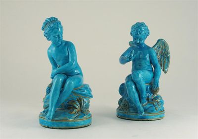 Appraisal: A pair of turquoise glazed porcelain models of Cupid and