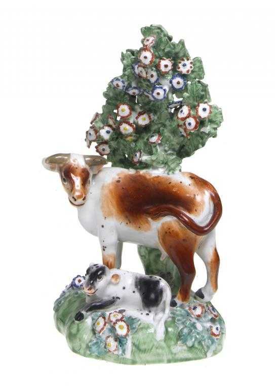 Appraisal: A DERBY MODEL OF A COW AND CALF enamelled in