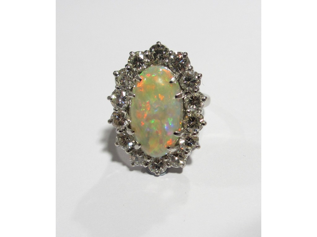 Appraisal: An impressive opal and diamond cluster ring the large opal