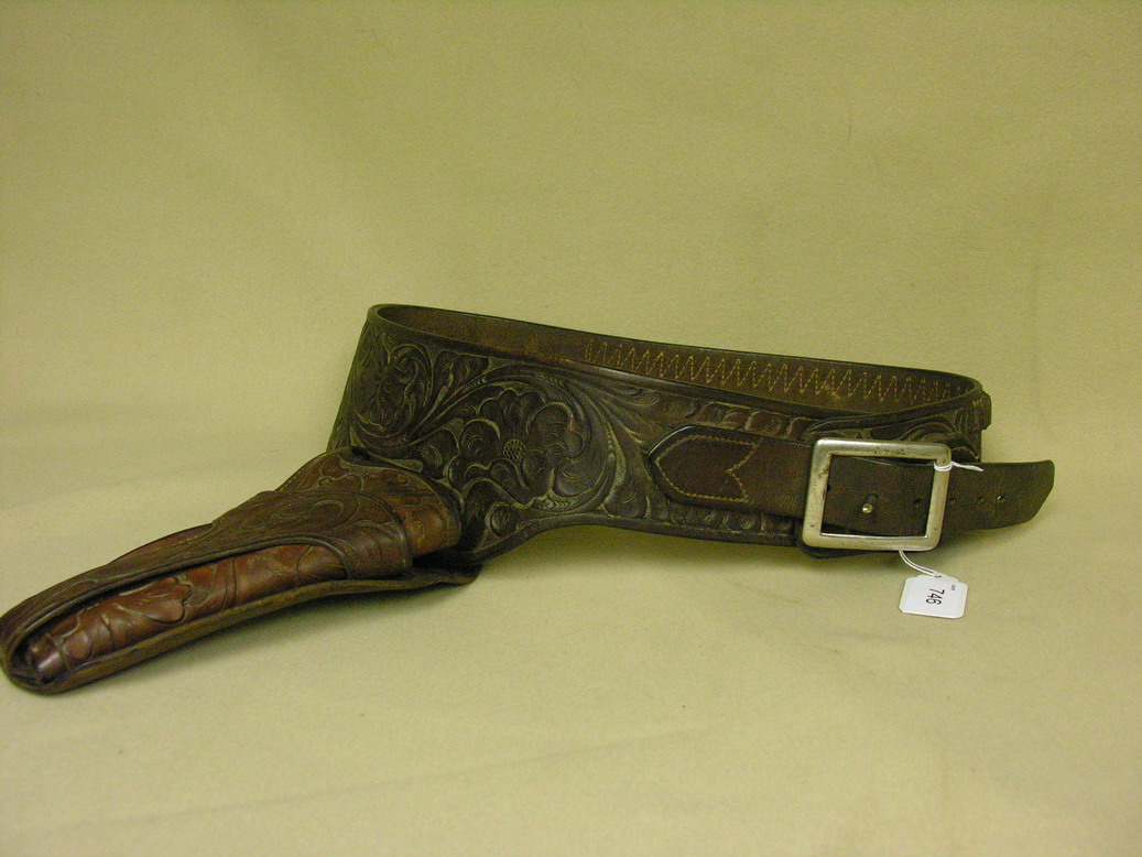 Appraisal: GEORGE LAWRENCE CO WESTERN HOLSTER AND BELT Vintage tooled leather