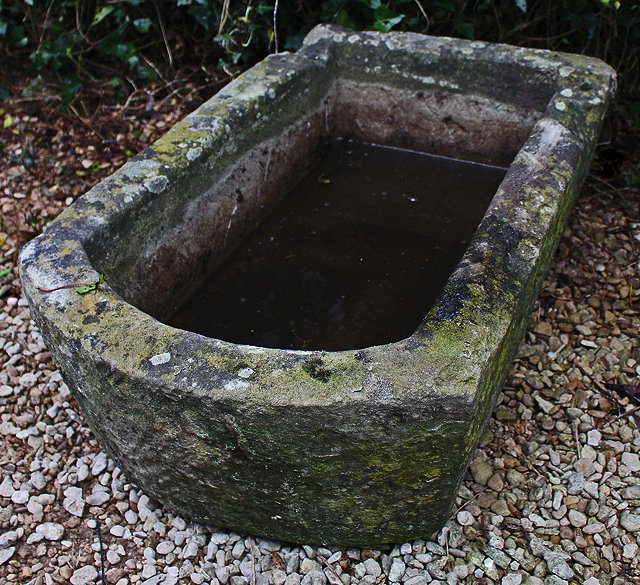 Appraisal: AN OLD STONE TROUGH with 'D' shaped end cm x