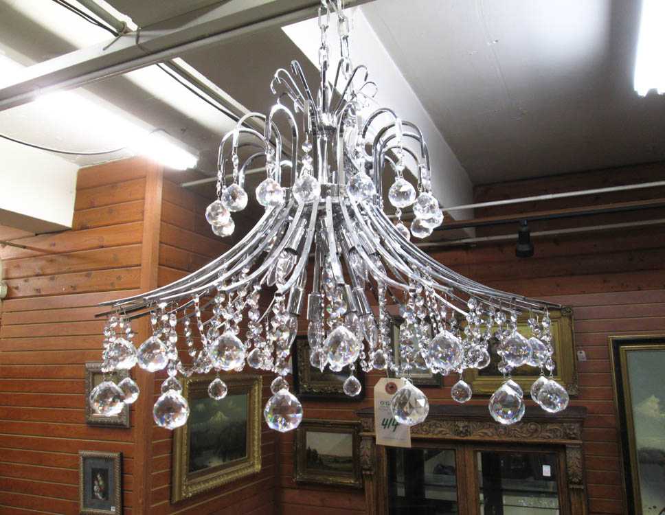 Appraisal: A CONTEMPORARY CRYSTAL AND CHROMED METAL CHANDELIER having downward swept