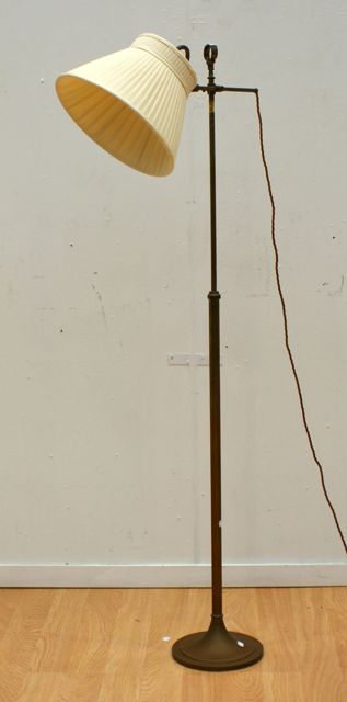 Appraisal: A pair of brass adjustable standard lamps