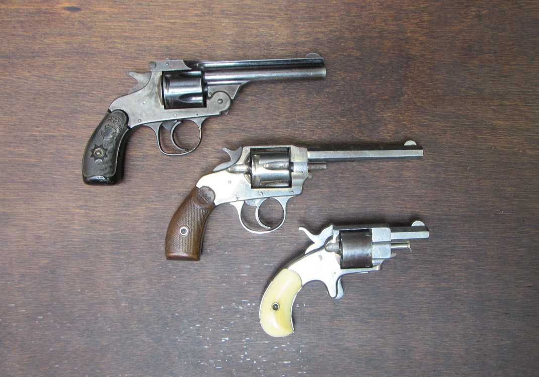 Appraisal: THREE COLLECTIBLE REVOLVERS Forehand Arms Co double action Centerfire caliber