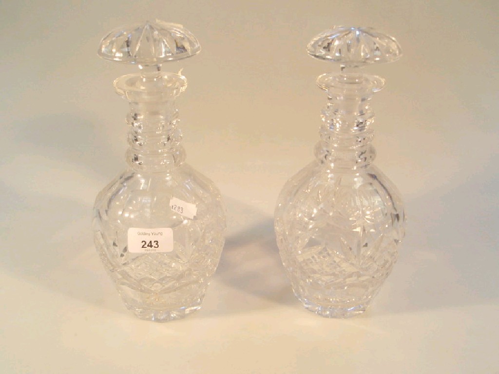 Appraisal: A pair of cut crystal mallet decanters with mushroom stoppers