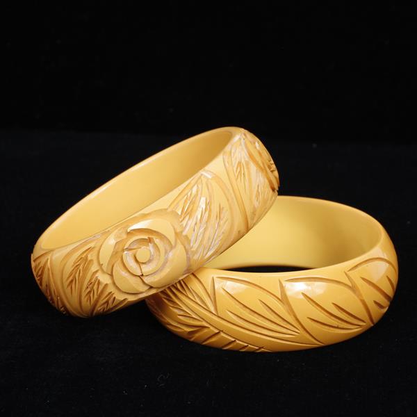 Appraisal: Two Carved Bakelite Bangle Bracelets dia