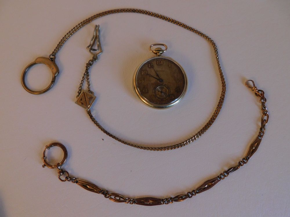 Appraisal: WALTHAM GOLD POCKET WATCH FOBS Antique Waltham pocket watch with