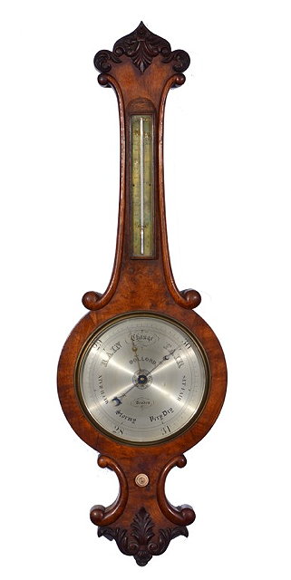 Appraisal: A VICTORIAN FIGURED OAK WHEEL BAROMETER the silvered dial signed