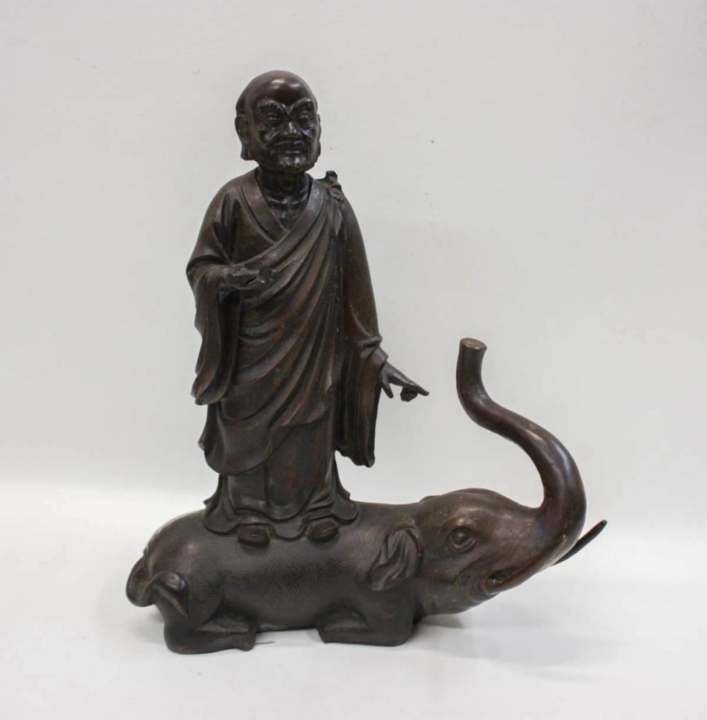 Appraisal: BRONZE FIGURAL SCULPTURE depicting a Chinese sage standing on an