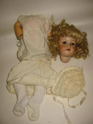 Appraisal: An Armand Marseille bisque head doll with fixed blue eyes