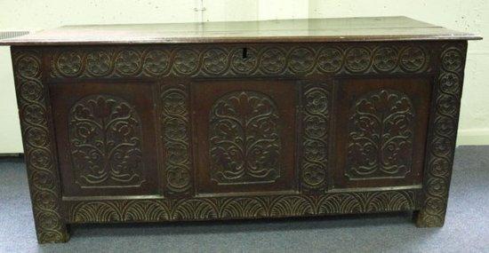 Appraisal: A th Century oak coffer the plank top over triple