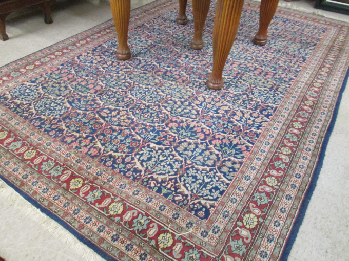 Appraisal: HAND KNOTTED ORIENTAL RUG Indo-Persian repeating overall floral decoration on