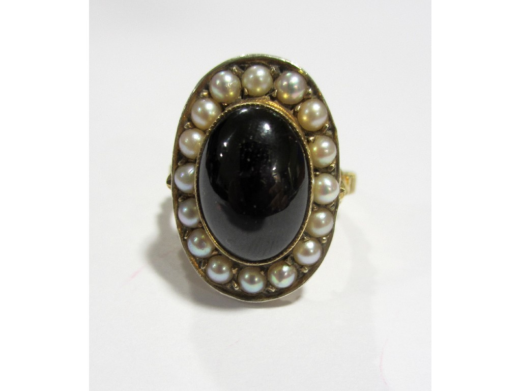 Appraisal: An attractive Edwardian ladies garnet and pearl dress ring the